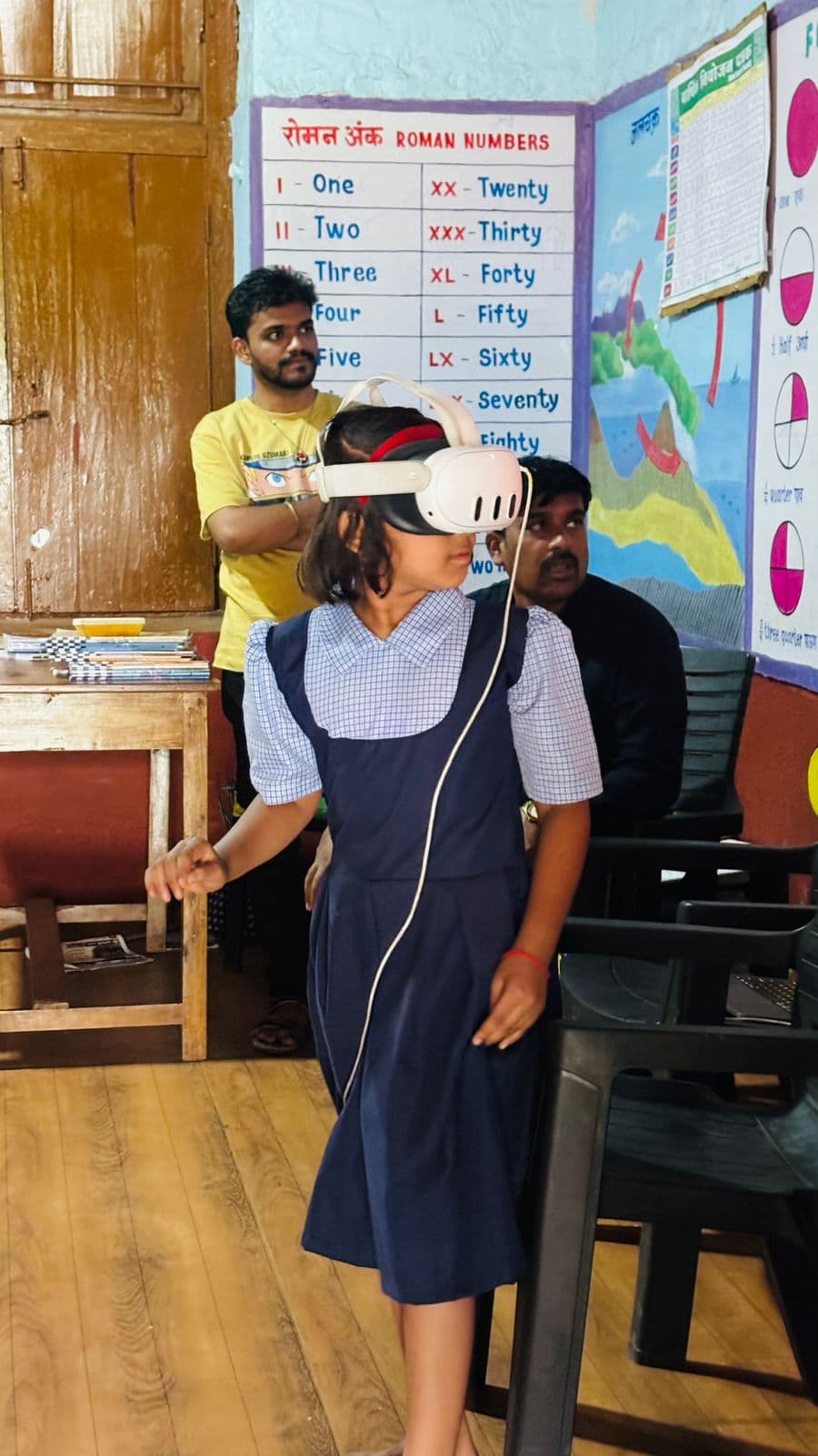 Educators helping students use Abhigyaan VR in a Maharashtra classroom